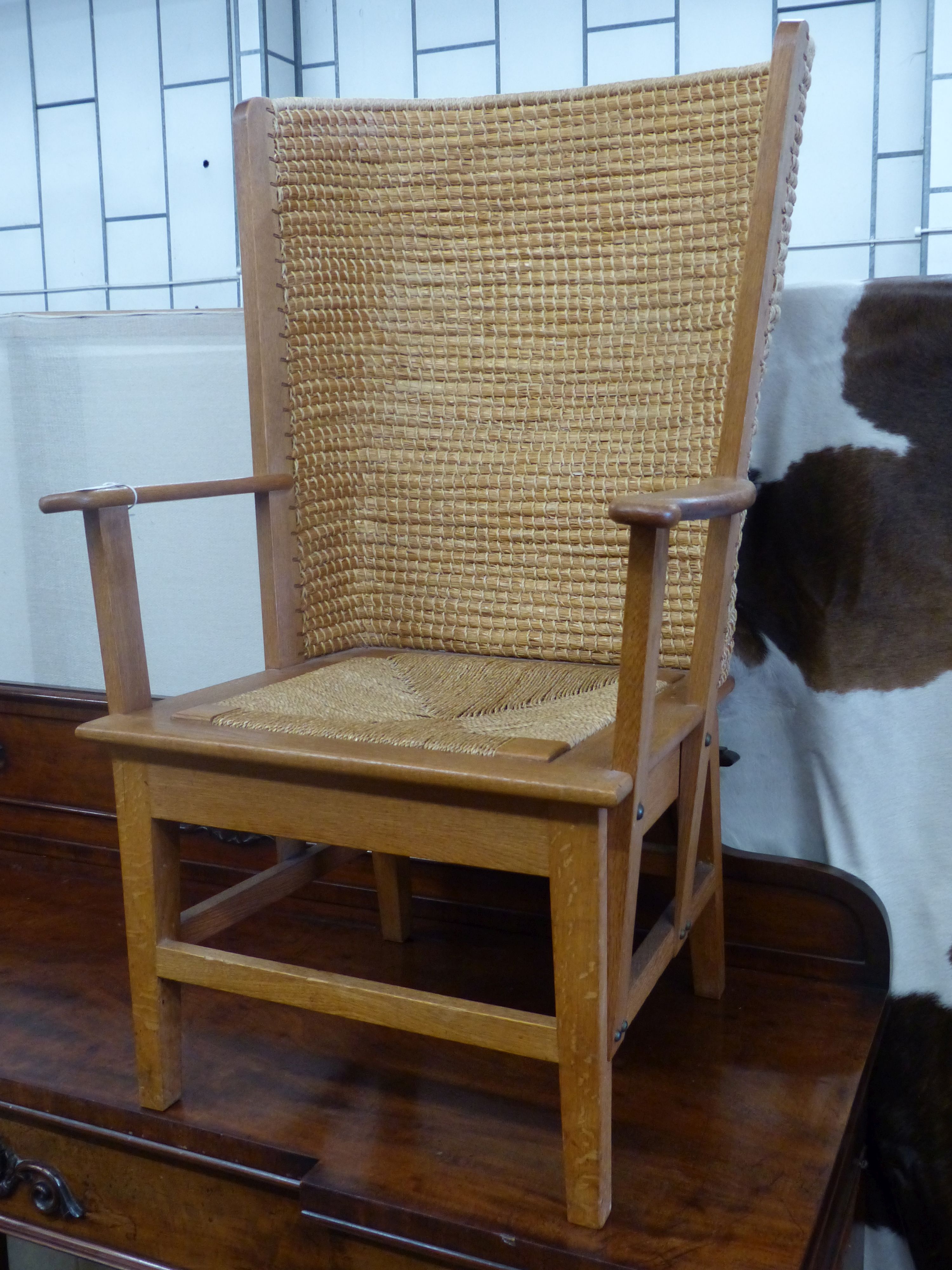 A 20th century light oak and skep work Orkney chair in traditional style, width 63cm, depth 60cm, height 106cm